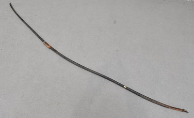 Lot 1169 - A late 19th century ebonised bow, height 214cm.