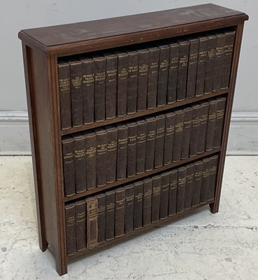 Lot 232 - An early 20th century oak bookcase containing...