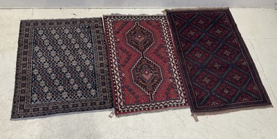 Lot 1410 - Three decorative Eastern rugs, each with...