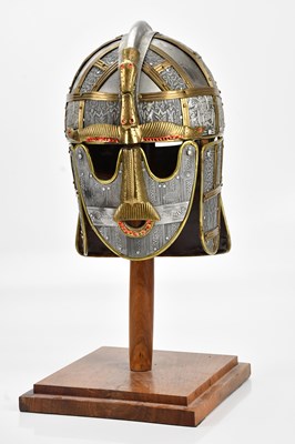 Lot 624 - A reproduction Sutton Hoo helmet, on wooden...