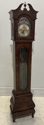 Lot 386 - A reproduction walnut effect longcase clock of...