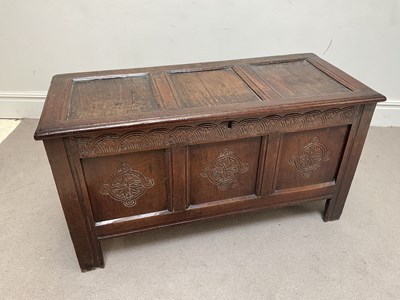Lot 1061 - An 18th century oak cover, with panelled top...