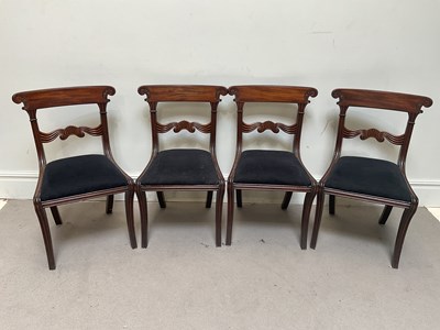 Lot 1176 - A set of four Regency carved mahogany dining...