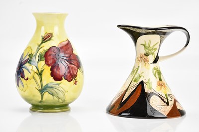 Lot 1495 - WALTER MOORCROFT; a baluster vase decorated in...