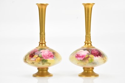 Lot 1414 - A pair of hand painted and gilt decorated...