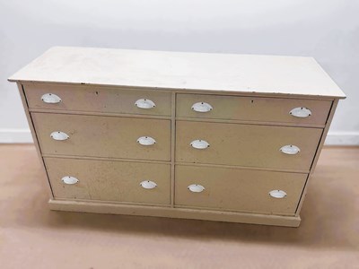 Lot 687 - A modern painted pine six drawer dresser base...