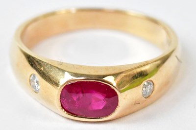 Lot 592 - A yellow metal ring set with a central oval...