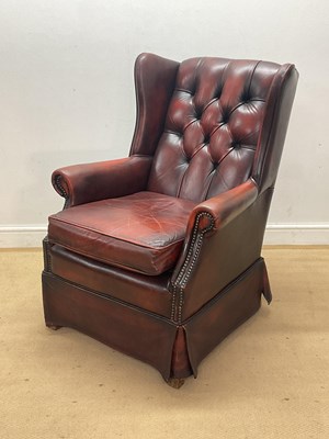 Lot 688 - A red leather buttonback Chesterfield armchair,...