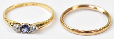 Lot 590 - A yellow metal ring set with a central...