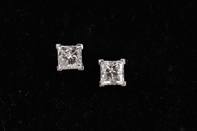 Lot 160 - A pair of diamond princess cut ear studs...