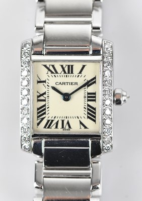 Lot 1105 - CARTIER; a lady's Tank Francaişe diamond set...