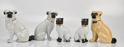 Lot 1282 - A collection of five ceramic pug figures,...
