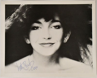 Lot 300 - KATE BUSH; a photograph, signed in blue pen to...