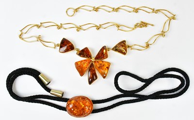 Lot 603 - A necklace set with Baltic amber cabochons in...