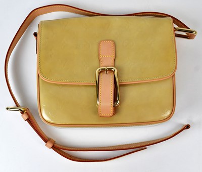 Lot 402 - LOUIS VUITTON; a yellow Vernis Christie GM...
