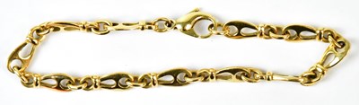 Lot 599 - An 18ct yellow gold fancy link bracelet,...