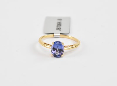 Lot 860 - An 18ct yellow gold ring set with an oval...