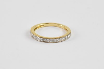 Lot 862 - An 18ct yellow gold diamond half eternity ring,...
