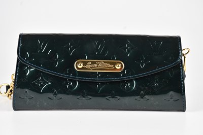Lot 1334 - LOUIS VUITTON; a dark green patent leather...