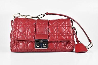 Lot 1329 - DIOR; a deep red calfskin leather new lock...