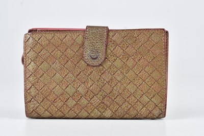 Lot 1256 - BOTTEGA VENETA; a metallic Intrecciato purse...