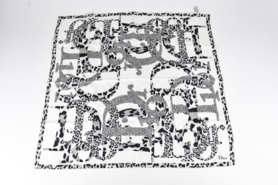 Lot 1266 - CHRISTIAN DIOR; a 100% silk black, cream, and...