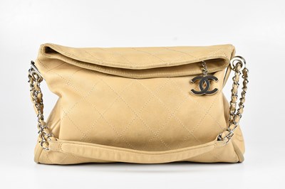 Lot 1248 - CHANEL; a beige lambskin leather ultimate soft...