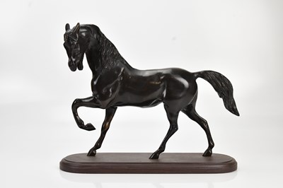 Lot 2143 - A large modern bronze model of a horse, on...