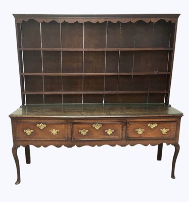 Lot 1049 - A George III Shropshire oak dresser, with...