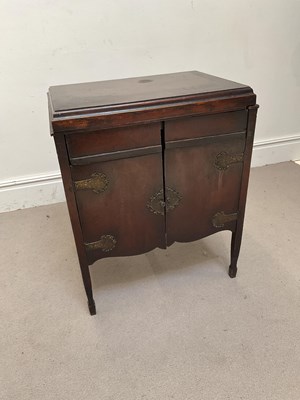 Lot 1086 - A 1920s oak two door cupboard, height 82cm,...