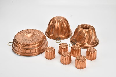 Lot 2118 - Three copper jelly moulds, largest diameter...