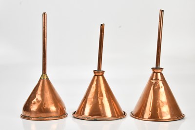 Lot 2119 - Three copper funnels, one with a brass collar,...