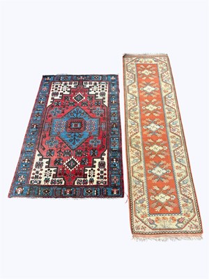 Lot 1391 - A Caucasian hand woven wool carpet, worked...