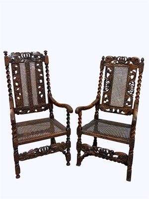 Lot 1068 - Two 17th century and later carved walnut arm...