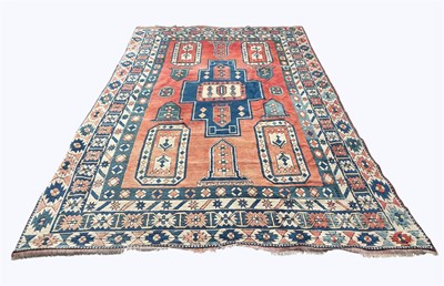 Lot 1382 - A Caucasian hand woven wool carpet, worked...