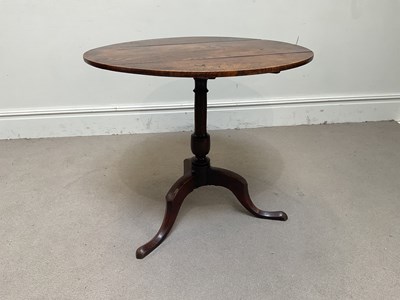 Lot 1074 - A George III oak tripod table, with circular...