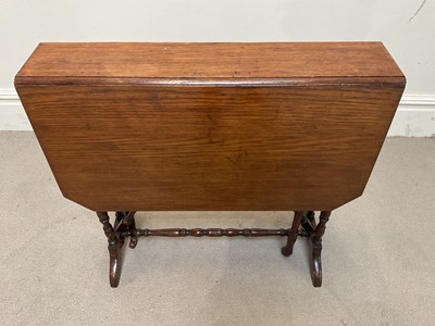 Lot 1300 - An Edwardian oak spider leg Sutherland table,...