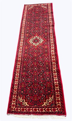 Lot 1393 - A Caucasian hand woven wool runner, worked...