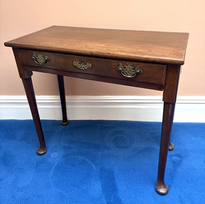 Lot 1075 - A George III oak side table, with drawer, on...