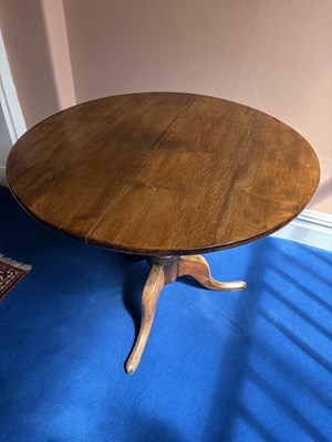 Lot 1079 - A George III oak tripod table, with turned...