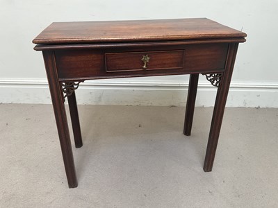 Lot 1228 - A George III mahogany fold-over tea table,...