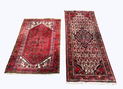 Lot 1394 - A Caucasian hand woven wool rug, worked with a...