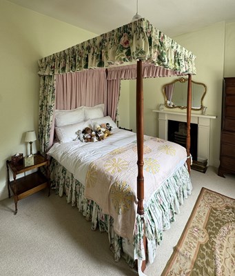 Lot 1172 - A modern pine four poster bed, with turned and...