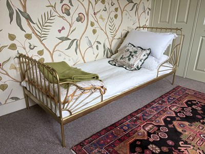 Lot 1167 - A pair of gilt metal single beds, in Victorian...