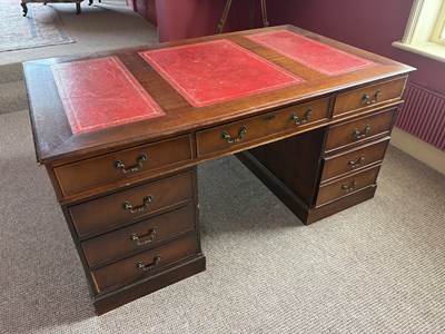 Lot 1097 - A reproduction mahogany library pedestal desk,...