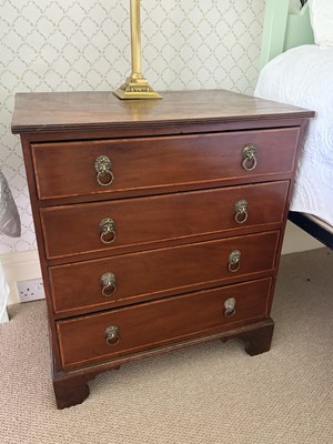Lot 1224 - A 19th century mahogany chest of four long...