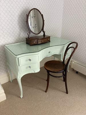 Lot 1255 - A pale green painted serpentine dressing table,...