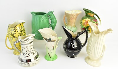 Lot 186 - Eight jug vases, designs including squirrel...