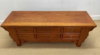 Lot 690 - A contemporary Asian hardwood platform table,...