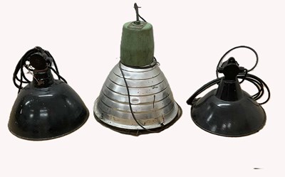 Lot 620 - Three industrial pendant lights, two enamel...